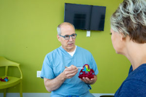 Dr. Casmedes peforming consultation with patient